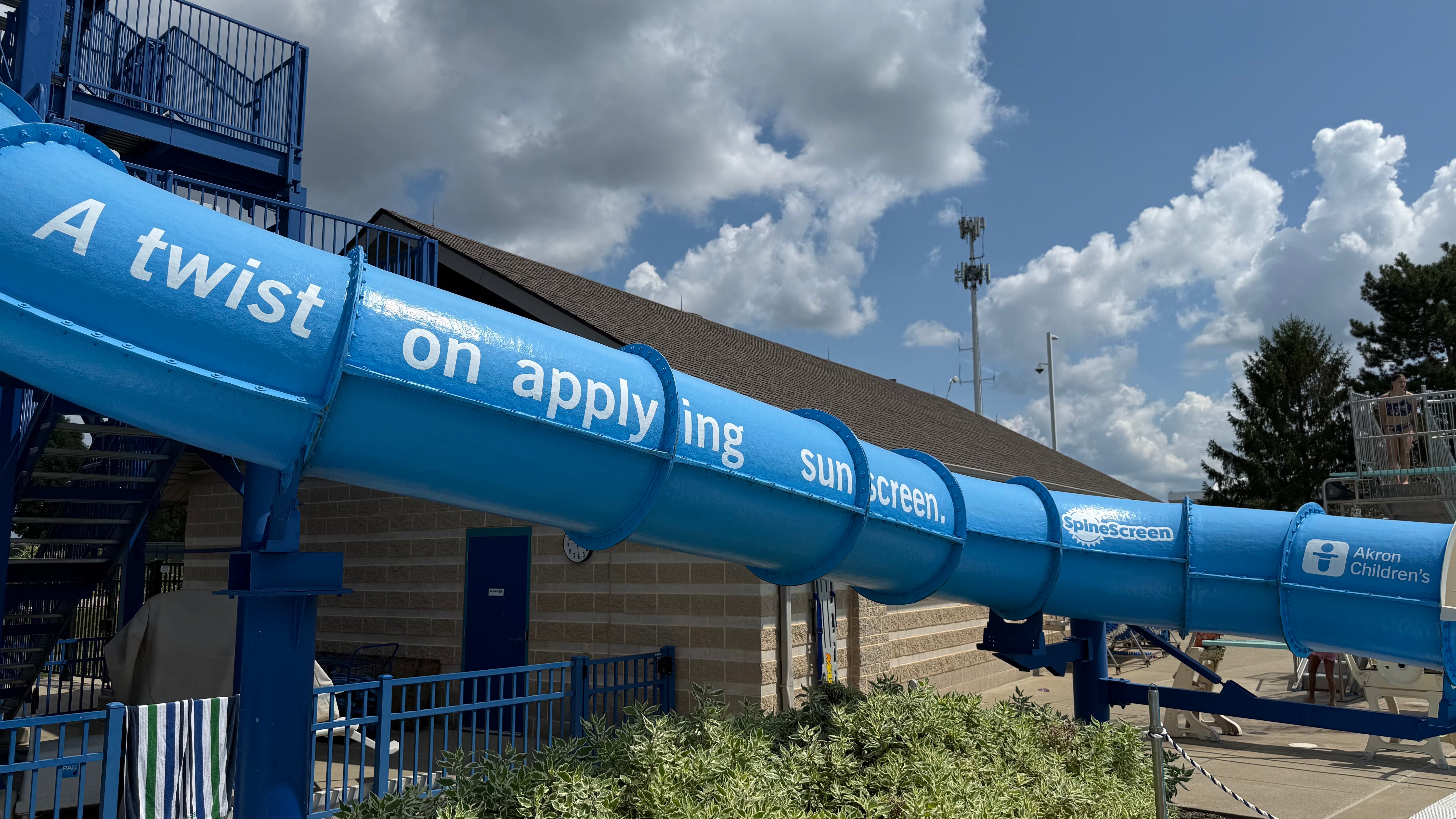 Cut-out vinyl graphic installed on the exterior curve of the Beachwood Family Aquatic Center waterslide.