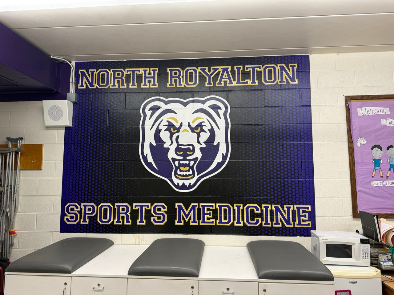 Printed wall mural on BrickWrap sticker for the Athletic Training Office at North Royalton HS in North Royalton, OH