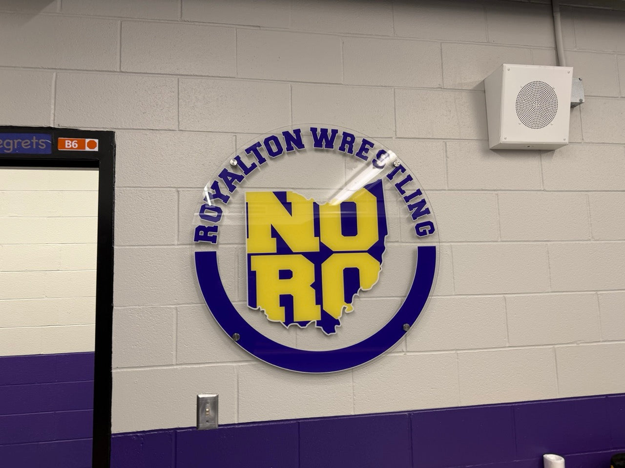 Printed clear acrylic wall display with white ink and stand-offs for Wrestling at North Royalton HS, in North Royalton, OH